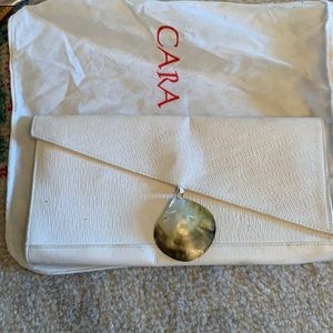 Cara Landy white leather clutch